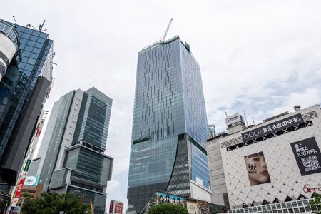 view of tall skyscraper buildings from streets of shibuya, tokyo, japan. Taken on June 28th 2019のeditorial素材