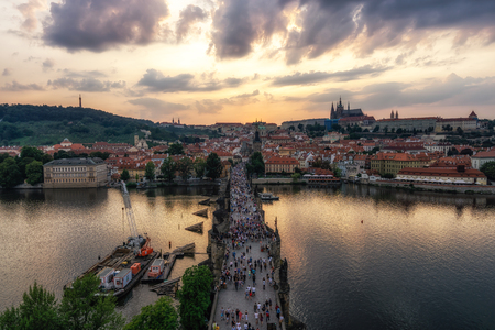 sunset over the Charles bridge and prague castle viewed from the old town tower observatory deck.のeditorial素材