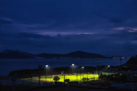 Sunset view over a soccer field in Namhae Sports Park in Namhae, South Koreaの写真素材