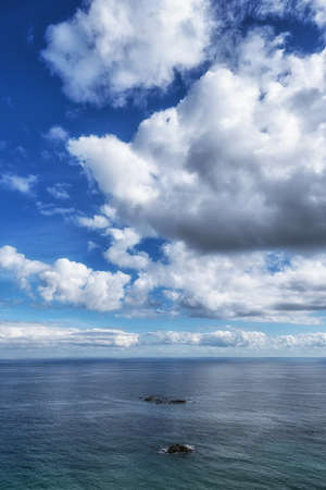 Rock formations and clouds viewed from Gyeongpo Beach in Gangneung, South Korea.