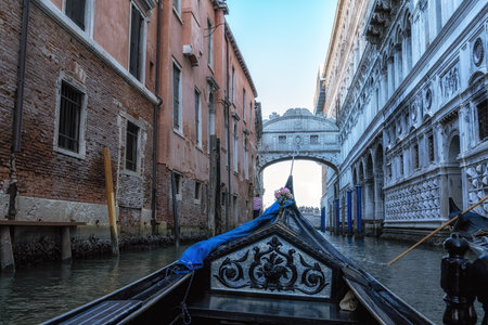 The view of the canal water and the famous Bridge of Sighs from a gondola ride. Venice, Italyの写真素材