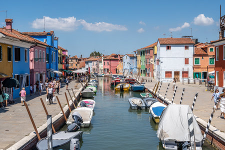 Brightly multi coloured houses over the canal in Burano, Italy. Famous island nearby Venice, Italy. Taken on July 14th 2022のeditorial素材