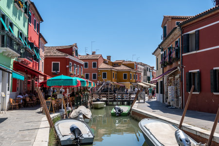Brightly multi coloured houses over the canal in Burano, Italy. Famous island nearby Venice, Italy. Taken on July 14th 2022のeditorial素材