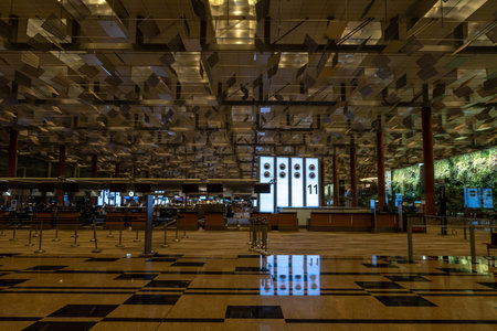 Singapore Changi Airport Terminal viewed at Night with the iconic ceiling architecture. Taken on October 10th 2022のeditorial素材