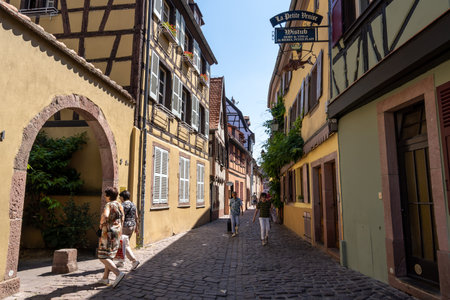 Small alleyway with Alsatian half timbered houses built along. Taken in Colmar, France on June 11 2023のeditorial素材