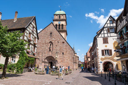 Small colorful german half timbered houses in Kaysersberg along the main street. Taken in Kaysersberg, France. Taken on June 11 2023のeditorial素材