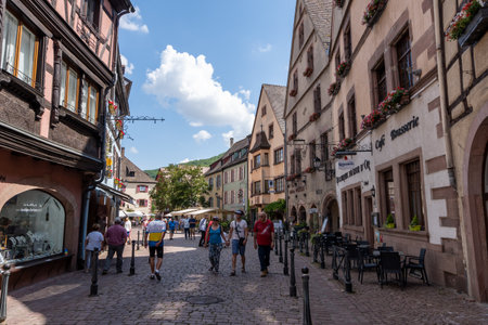 Small colorful german half timbered houses in Kaysersberg along the main street. Taken in Kaysersberg, France. Taken on June 11 2023のeditorial素材