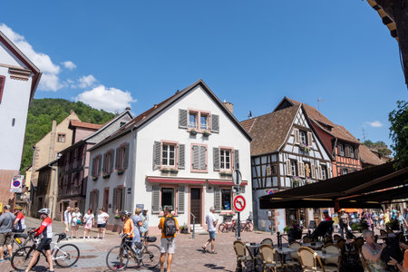 Small colorful german half timbered houses in Kaysersberg along the main street. Taken in Kaysersberg, France. Taken on June 11 2023のeditorial素材