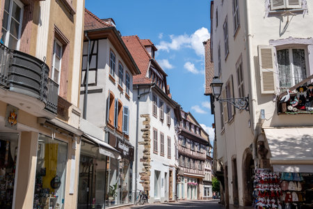 Colmar old town street with tourists walking about. Half timbered colorful german houses taken in Colmar, France. Taken on June 11 2023のeditorial素材