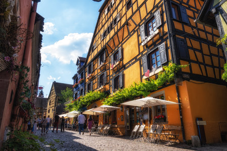 Riquewihr historical town with half timbered houses along the narrow cobble stoned street. Taken in Riquewihr, France on June 11 2023のeditorial素材