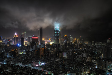 Panoramic view over Taipei 101 and surrounding buildings at night during a rain storm. Famous iconic skyscraper in Taiwan.の写真素材