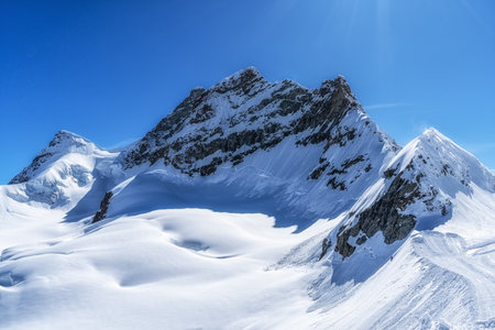 Snow covered Jungfraujoch mountain top range taken from nearby Sphinx Observatory. Famous landmark...