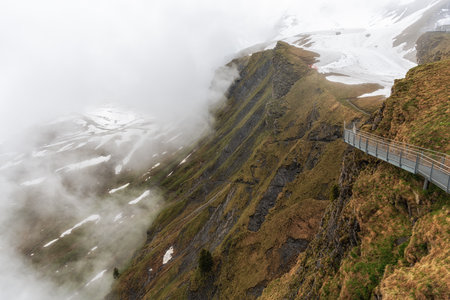 Grindelwald first cliff walk viewed from on top of the summit mountain top in Grindelwald,...