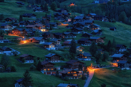 Small tourist town of Grindelwald valley in Switzerland taken at night. Famous tourist attraction in Switzerland.の写真素材