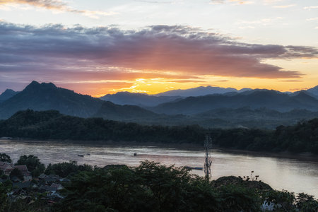 View of sunset over the mekong river and Luang Prabang taken from Phousi Hill. Famous tourist destination in Luang Prabang, Laosの写真素材