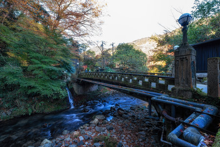 Autumn fall foliage scenery near a stone bridge over Yoshina River. Famous tourist attraction in Izu, Shizuoka, Japanの写真素材