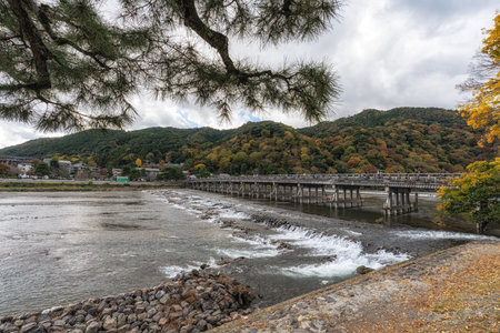 Togetsukyo bridge over Katsura River taken during autumn foliage season. Arashiyama, Kyoto, Japanの写真素材