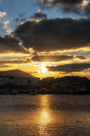 Sunset view over Naousa Marina in Paros taken during winter season. Famous iconic tourist village in Paros, Greeceの写真素材