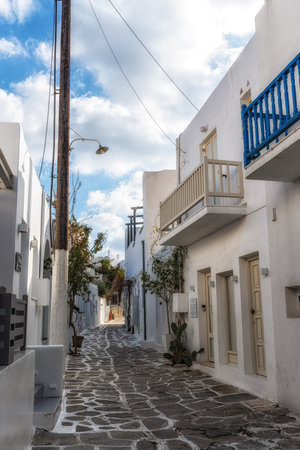 White color painted houses and narrow alleyways of Naousa Fishing Village in Paros, Greeceの写真素材