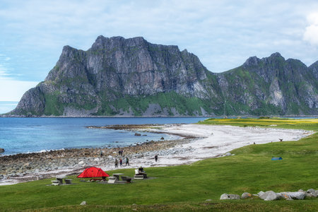 Uttakleiv beach with its rocky coastal formations taken during summer. Famous beach in Lofoten islands, Norwayの写真素材