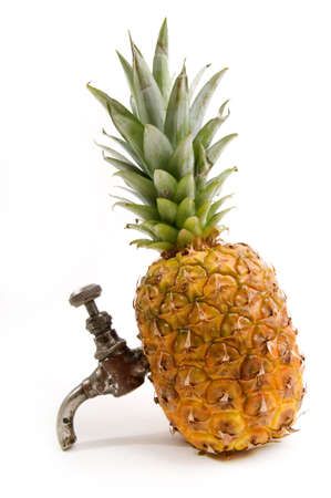 Juicy pineapple with tap as source of vitaminの写真素材