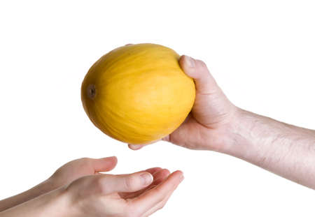 Hand's passing fruit melonの写真素材