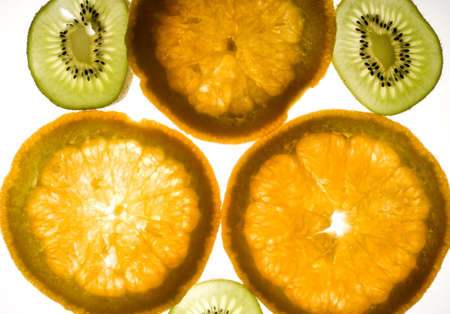 Kiwi and orange fruits full of lightの写真素材
