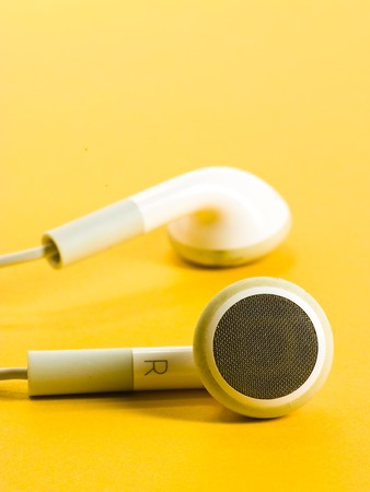 earphones against yellow backgroundの写真素材