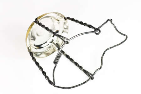 champagne metal cork cage on white backgroundの写真素材