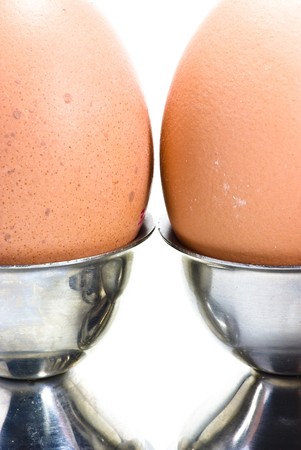 brown eggs on eggcupsの写真素材