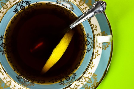 teacup on green backgroundの写真素材