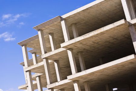 unfinished building against blue sky