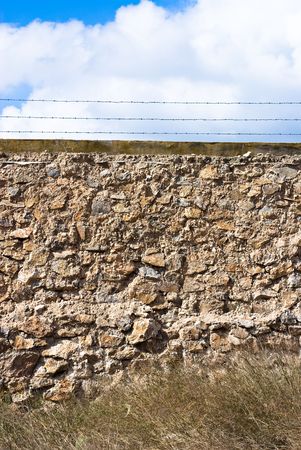 stones wall against blue skyの写真素材