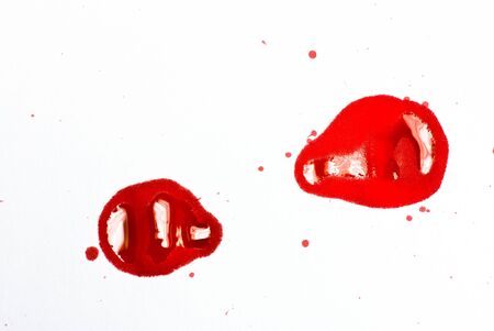 red ink stains on white background