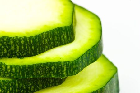 cucumber slices on white backgroundの写真素材