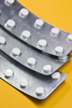 medical pills on yellow backgroundの写真素材