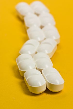 tablets on yellow backgroundの写真素材