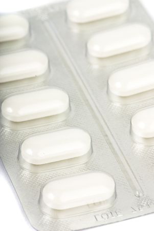 white tablets on white background