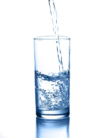pouring water isolated on a white backgroundの写真素材