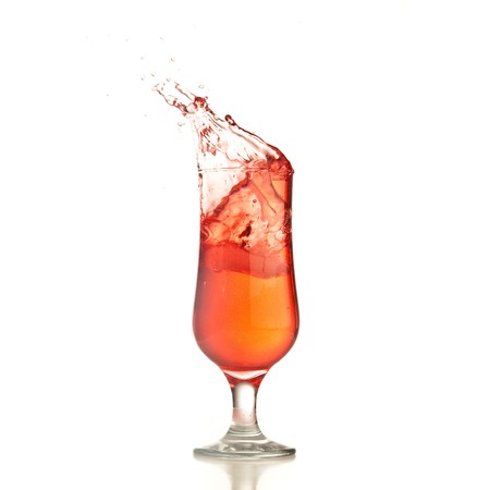 cocktail splash isolated on a white backgroundの写真素材