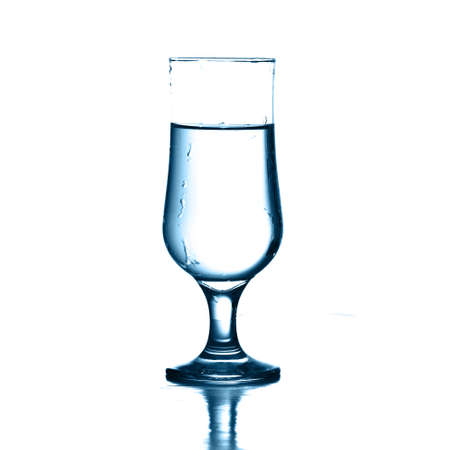 water on elegant glass on white backgroundの写真素材