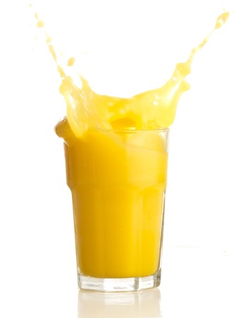 orange juice splash on a white backgroundの写真素材