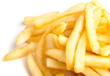extreme closeup of fried potatoes on white backgroundの写真素材