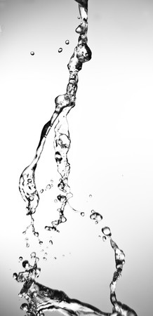 closeup of water splash on a white backgroundの写真素材