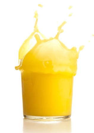 orange juice splash on a white backgroundの写真素材