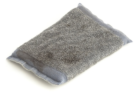 dirty scourer isolated on a white backgroundの写真素材