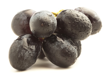 black grapes isolated on a white backgroundの写真素材