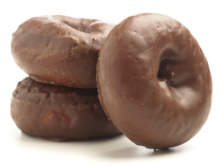 chocolate doughtnut pile on a white backgroundの写真素材