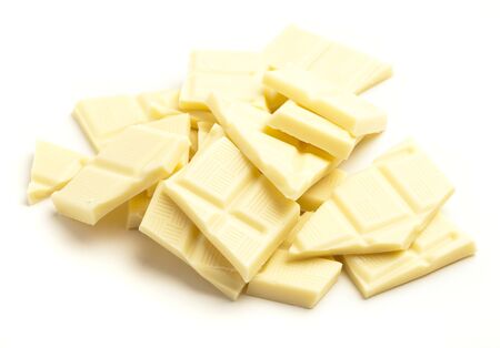 white chocolate pieces isolated on a white backgroundの写真素材