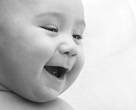 baby smiling, black and white photo closeupの写真素材